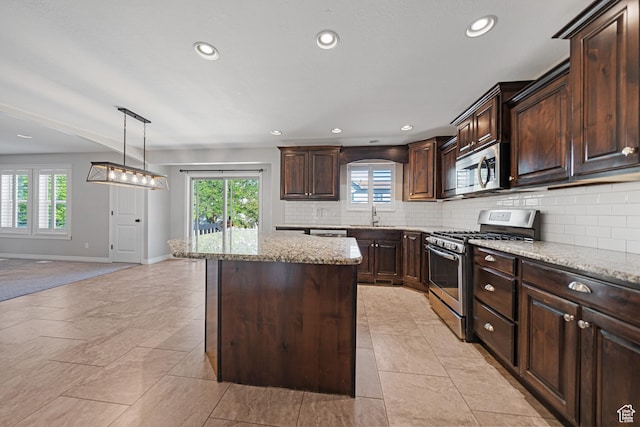 488 N 1375 E, Layton, UT 84040 - kitchen featuring appliances with stainless steel finishes, plenty of natural light, decorative backsplash, and recessed lighting