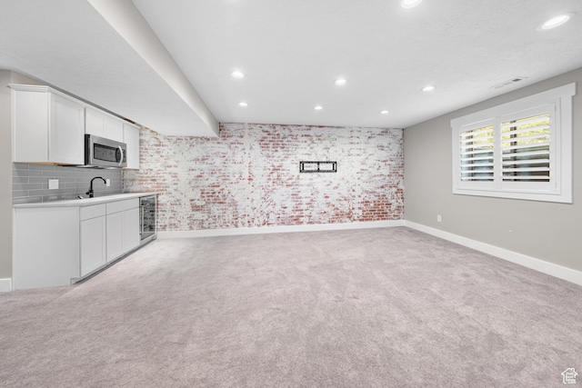 488 N 1375 E, Layton, UT 84040 - unfurnished living room with light carpet, beverage cooler, and recessed lighting