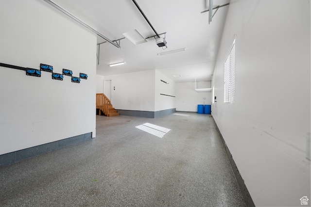 488 N 1375 E, Layton, UT 84040 - garage featuring a garage door opener and baseboards