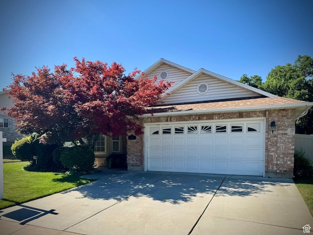 1341 E 5200 S, South Ogden, UT 84403 - view of property hidden behind natural elements with driveway, a garage, brick siding, a front yard, and a shingled roof
