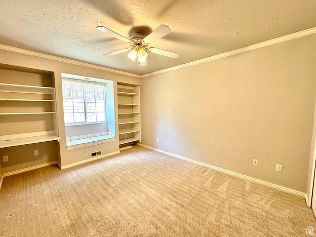 1341 E 5200 S, South Ogden, UT 84403 - spare room with built in features, a textured ceiling, carpet flooring, crown molding, and ceiling fan