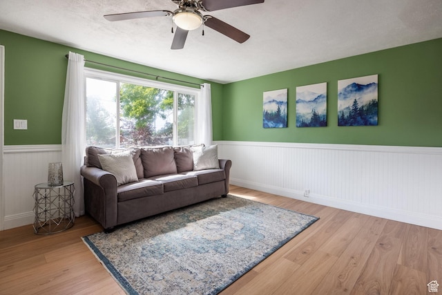 190 N 200 E, Pleasant Grove, UT 84062 - living area with wainscoting, wood finished floors, and a ceiling fan