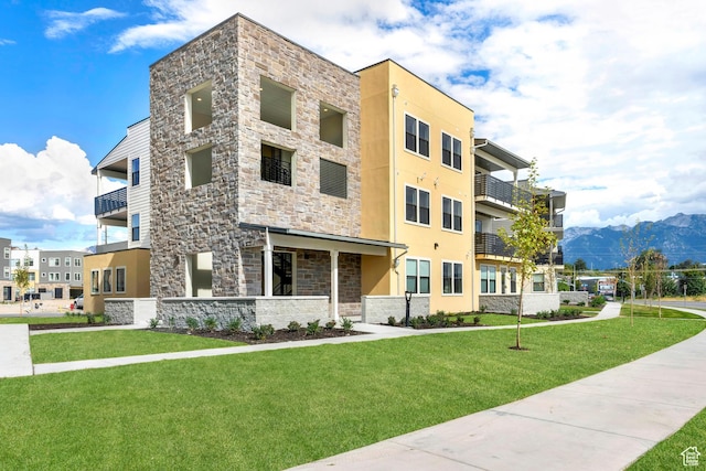 736 W Blue Magic Ln S Unit R201, Midvale, UT 84047 - view of building exterior with a mountain view