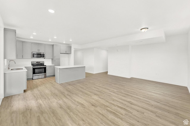 736 W Blue Magic Ln S Unit R201, Midvale, UT 84047 - kitchen featuring stainless steel appliances, open floor plan, gray cabinetry, recessed lighting, and light countertops