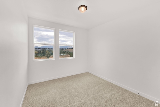 736 W Blue Magic Ln S Unit R201, Midvale, UT 84047 - carpeted spare room featuring baseboards
