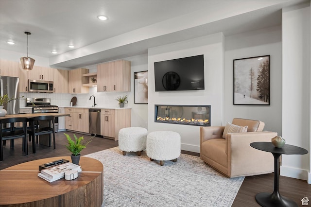 3840 N 4975 E Unit A104, Eden, UT 84310 - living area featuring dark wood finished floors, recessed lighting, and a glass covered fireplace