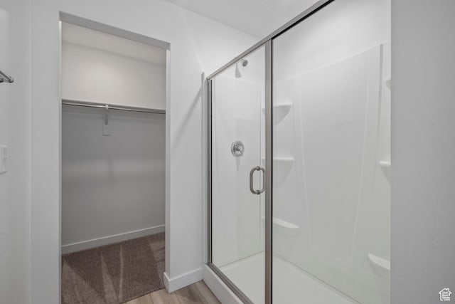 2522 N Wildwood Ln E Unit 240, Heber City, UT 84032 - full bath with a stall shower, a spacious closet, and wood finished floors