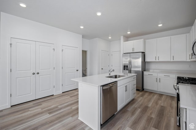 2522 N Wildwood Ln E Unit 240, Heber City, UT 84032 - kitchen with stainless steel appliances, light wood-style floors, light countertops, white cabinets, and recessed lighting