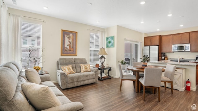 6069 W Franciscotti Dr Unit 473, South Jordan, UT 84009 - living area with healthy amount of natural light, recessed lighting, and wood finished floors