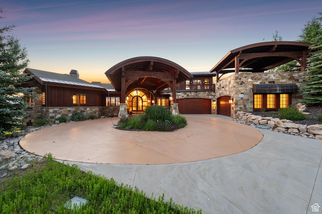 7881 N W Hills Trl, Park City, UT 84098 - view of front of home featuring stone siding and curved driveway