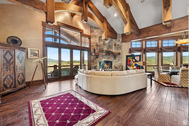 7881 N W Hills Trl, Park City, UT 84098 - living area featuring high vaulted ceiling, beamed ceiling, hardwood / wood-style flooring, and a fireplace