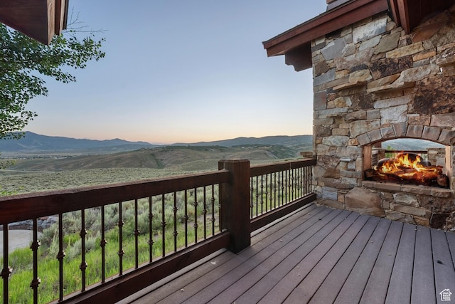 7881 N W Hills Trl, Park City, UT 84098 - deck featuring a fireplace and a mountain view