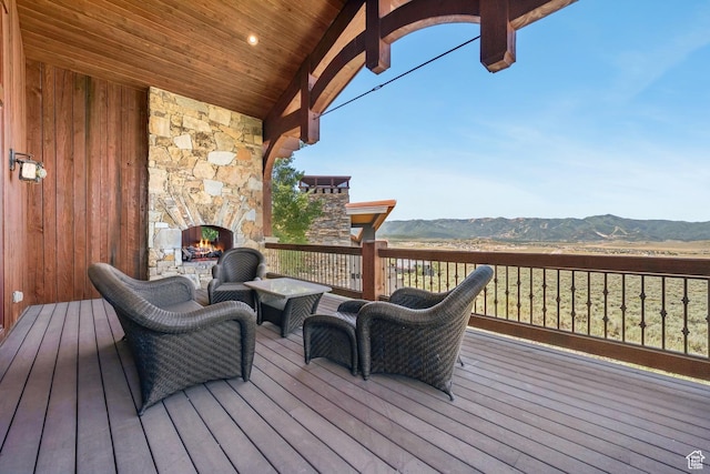 7881 N W Hills Trl, Park City, UT 84098 - deck featuring a mountain view and an outdoor living space with a fireplace