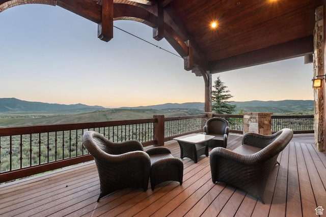 7881 N W Hills Trl, Park City, UT 84098 - deck at dusk with a mountain view