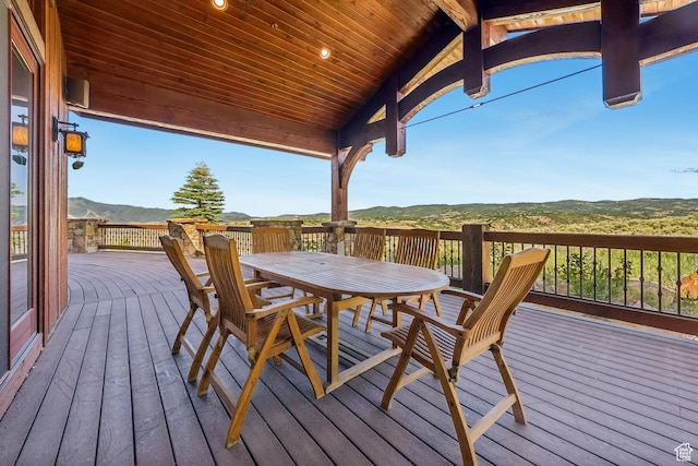 7881 N W Hills Trl, Park City, UT 84098 - wooden deck featuring a mountain view and outdoor dining space