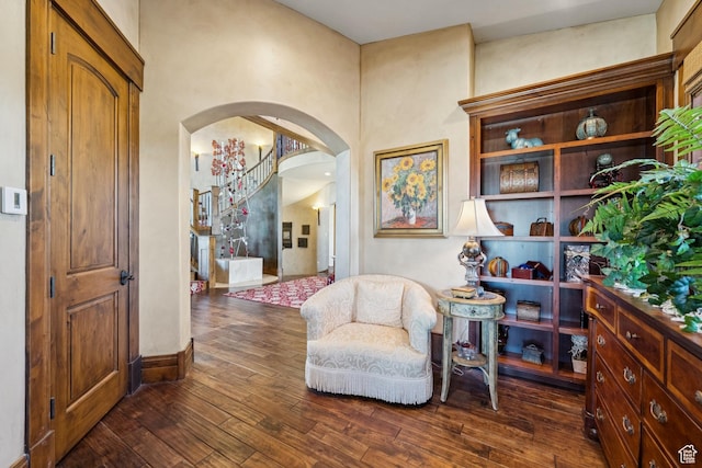 7881 N W Hills Trl, Park City, UT 84098 - sitting room with arched walkways and dark wood-type flooring