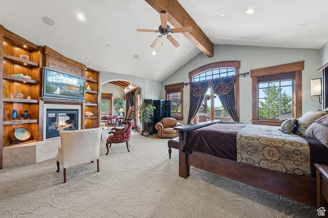 7881 N W Hills Trl, Park City, UT 84098 - carpeted bedroom with arched walkways, recessed lighting, beam ceiling, a glass covered fireplace, and high vaulted ceiling