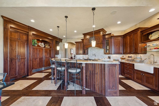 7881 N W Hills Trl, Park City, UT 84098 - kitchen with open shelves, inlaid floor details, arched walkways, and recessed lighting
