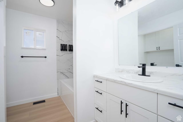 3189 S 4000 W, Roosevelt, UT 84066 - full bath featuring vanity, wood finished floors, and bathing tub / shower combination