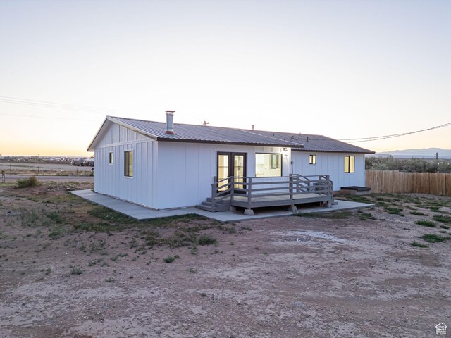 3189 S 4000 W, Roosevelt, UT 84066 - back of property featuring french doors, a deck, a metal roof, and board and batten siding