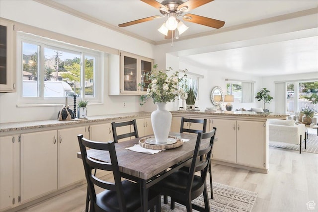 2684 E 2900 S, Millcreek, UT 84109 - dining area featuring light wood-style floors, a ceiling fan, and ornamental molding