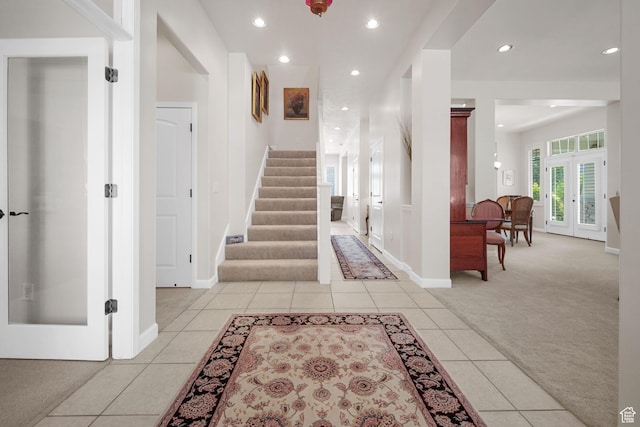 10693 S Vermillion Dr, South Jordan, UT 84009 - entrance foyer with light carpet, light tile patterned floors, recessed lighting, stairway, and french doors