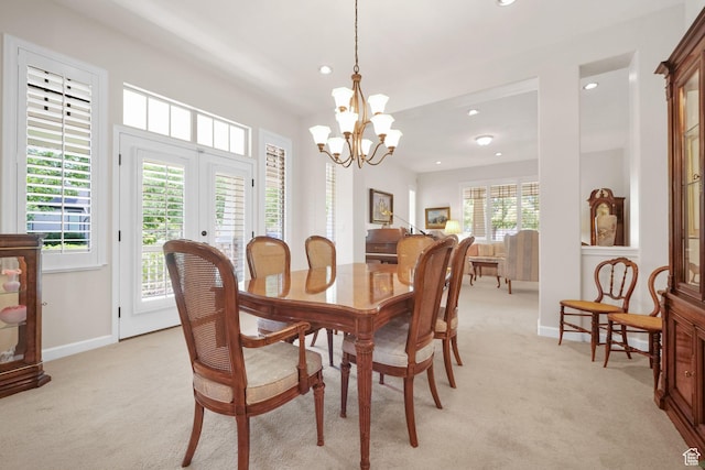 10693 S Vermillion Dr, South Jordan, UT 84009 - dining area with light carpet, recessed lighting, a chandelier, and french doors