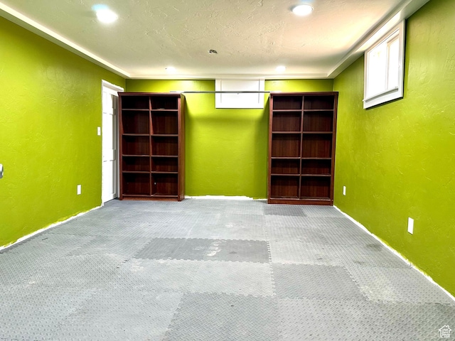 3060 S 2500 E, Vernal, UT 84078 - basement with carpet flooring, a textured wall, and plenty of natural light