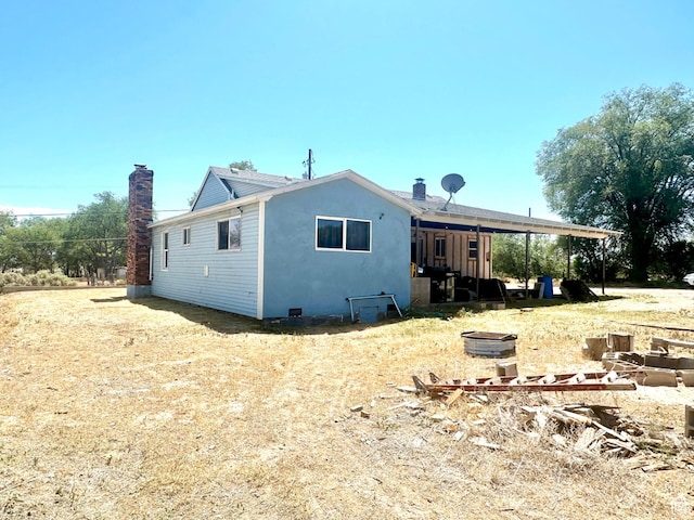 3060 S 2500 E, Vernal, UT 84078 - back of property with a chimney and stucco siding