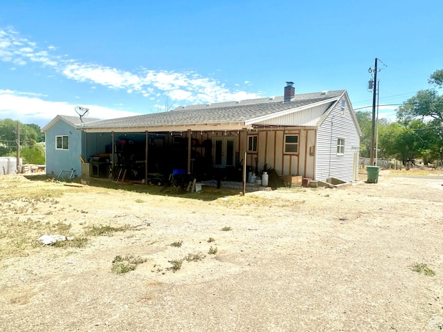 3060 S 2500 E, Vernal, UT 84078 - rear view of house with a chimney and a shingled roof