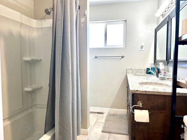 3060 S 2500 E, Vernal, UT 84078 - full bath featuring double vanity, tile patterned flooring, and shower / tub combo with curtain