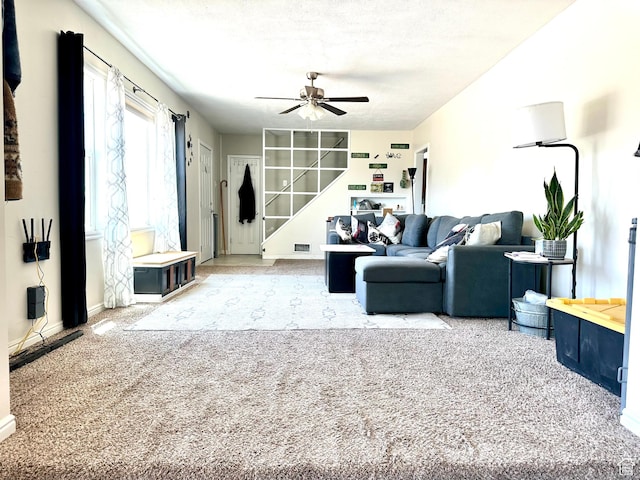 3060 S 2500 E, Vernal, UT 84078 - living room featuring carpet, ceiling fan, and stairs