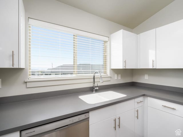 1141 E 1320 S Unit A401, Provo, UT 84606 - kitchen with stainless steel dishwasher, dark countertops, white cabinets, and lofted ceiling