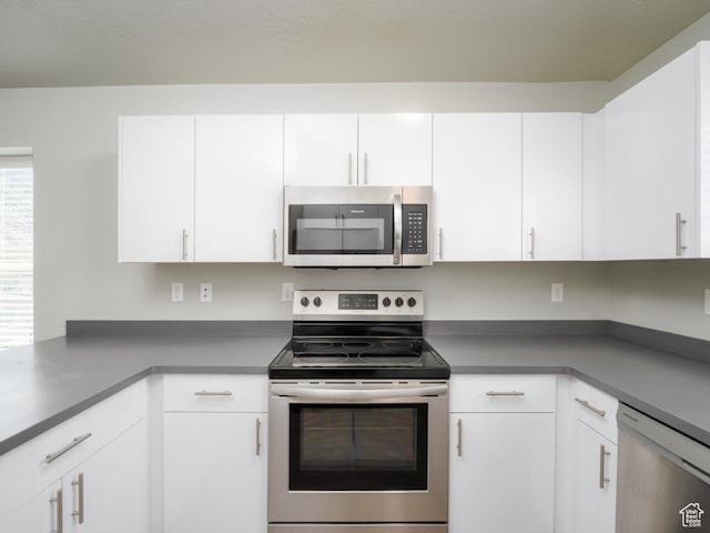 1141 E 1320 S Unit A401, Provo, UT 84606 - kitchen with appliances with stainless steel finishes, white cabinetry, and dark countertops