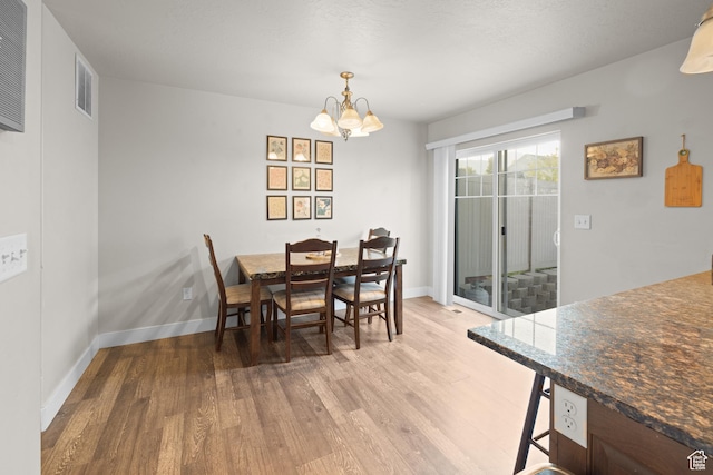 2501 W 1100 N, Provo, UT 84604 - dining area with light wood-type flooring and a chandelier