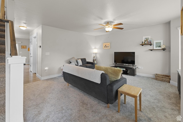 2501 W 1100 N, Provo, UT 84604 - living room featuring light carpet, ceiling fan, and stairway