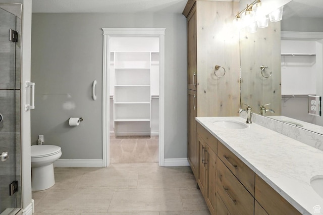 1470 N Cobblewood Ct, Kaysville, UT 84037 - bathroom with a spacious closet, double vanity, a shower stall, and tile patterned flooring
