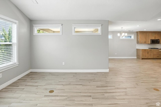 1470 N Cobblewood Ct, Kaysville, UT 84037 - unfurnished living room with recessed lighting, a chandelier, and light wood finished floors