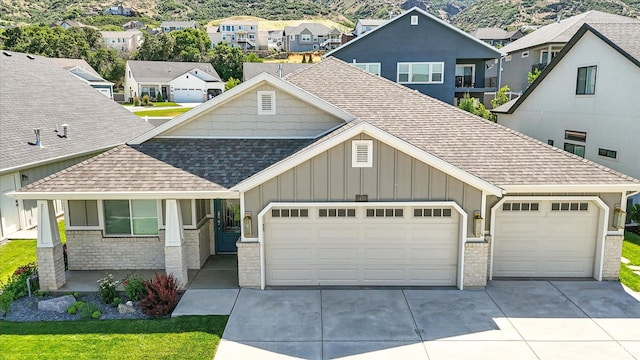 1470 N Cobblewood Ct, Kaysville, UT 84037 - craftsman inspired home featuring roof with shingles, board and batten siding, an attached garage, driveway, and a residential view