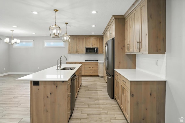 1470 N Cobblewood Ct, Kaysville, UT 84037 - kitchen with stainless steel appliances, a chandelier, light wood-style flooring, light countertops, and recessed lighting