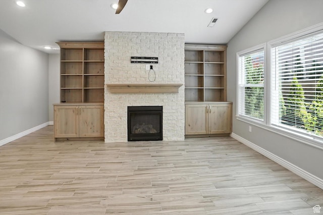 1470 N Cobblewood Ct, Kaysville, UT 84037 - unfurnished living room featuring recessed lighting, a brick fireplace, vaulted ceiling, and light wood finished floors