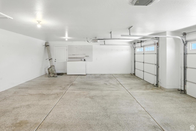 1470 N Cobblewood Ct, Kaysville, UT 84037 - garage with a garage door opener and fridge
