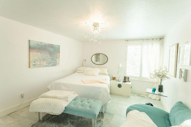 48 N White Barn Dr W, Pleasant View, UT 84414 - tiled bedroom with baseboards and a chandelier