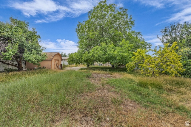 5350 S 3450 W, Roy, UT 84067 - view of yard featuring a shed