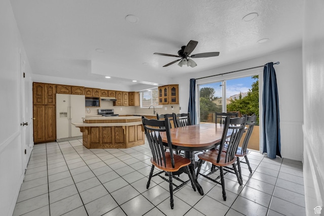 5350 S 3450 W, Roy, UT 84067 - dining space featuring recessed lighting, a ceiling fan, light tile patterned floors, a textured ceiling, and a wainscoted wall