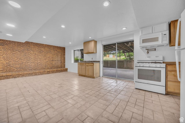 5350 S 3450 W, Roy, UT 84067 - kitchen with white appliances, brick wall, healthy amount of natural light, recessed lighting, and open floor plan