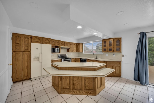 5350 S 3450 W, Roy, UT 84067 - kitchen with white refrigerator with ice dispenser, stainless steel electric range oven, brown cabinets, light countertops, and recessed lighting