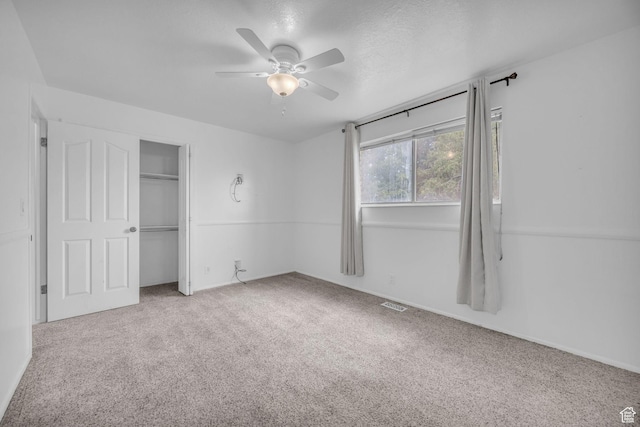 5350 S 3450 W, Roy, UT 84067 - unfurnished bedroom with carpet floors, a closet, and a ceiling fan