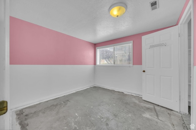 5350 S 3450 W, Roy, UT 84067 - empty room featuring unfinished concrete floors and a textured ceiling