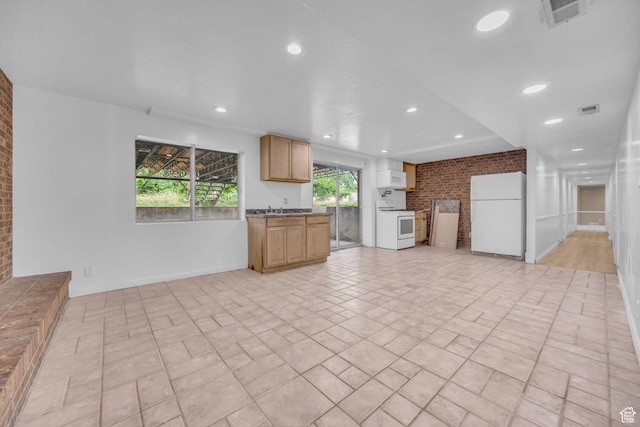 5350 S 3450 W, Roy, UT 84067 - unfurnished living room with brick wall and recessed lighting